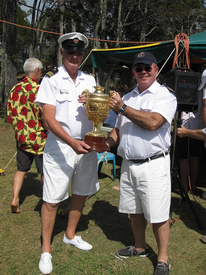 SYC Commodore, Phil Short (left), receives the Goodwill Cup from Royal Queensland Yacht Squadron Commodore, Kevin Miller. © Rob Mundle